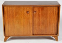 Lot 58 - A mid 20th Century walnut side cabinet, with...