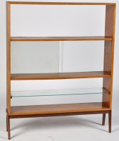 Lot 60 - A teak open bookcase, fitted with central...
