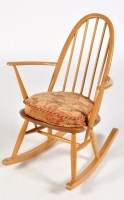 Lot 70 - Ercol: a light stained beech solid seat...