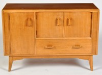 Lot 76 - G-Plan: an oak side cabinet, fitted three...