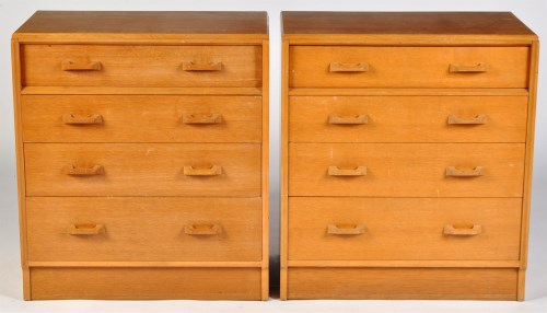 Lot 77 - G-Plan: a pair of oak chests of four long...