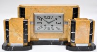Lot 104 - An Art Deco yellow and black marble clock...