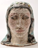 Lot 128 - A pottery mask of a female head, stamped 'BKA'...
