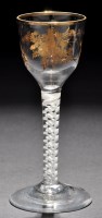 Lot 202 - An ogee bowl wine glass, with floral gilding...