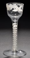 Lot 204 - An ogee wine glass, enamelled with the...
