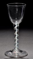 Lot 207 - A colour twist wine glass, the round funnel...