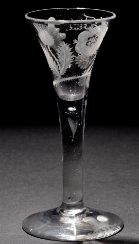 Lot 214 - A rare Jacobite wine glass, the drawn trumpet...