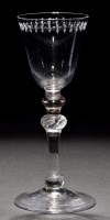 Lot 234 - A light baluster goblet, the round funnel bowl...