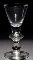 Lot 237 - A heavy baluster goblet, the conical bowl with...