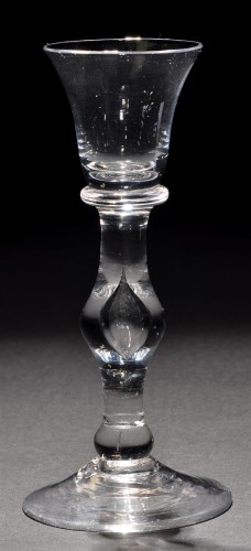 Lot 242 - A baluster cordial glass, the flared bell bowl...