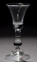Lot 244 - A baluster wine glass, the bell bowl with a...