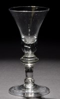 Lot 245 - A baluster wine glass, the bell bowl with...