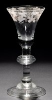 Lot 248 - A baluster wine glass, the bell bowl with...