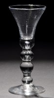 Lot 253 - A baluster wine glass, the waisted bell bowl...