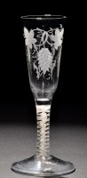 Lot 267 - An ale glass, the elongated ogee bowl engraved...