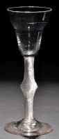 Lot 275 - A pan topped wine glass, raised on a...