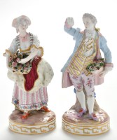 Lot 389 - Pair of German figures of flower sellers in...