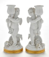 Lot 391 - Pair of Vista Alegre cherub candlesticks, each...