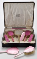 Lot 483 - A George V six-piece silver and pink enamel...