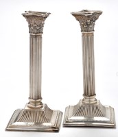 Lot 502 - A pair of George IV candlesticks, by J....