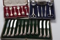 Lot 504 - Six George V fruit forks and matching knives,...