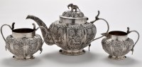 Lot 564 - An Indian white metal three piece tea service,...