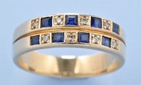 Lot 599 - A sapphire and diamond ring, set with...