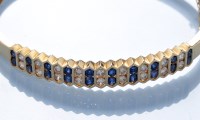 Lot 600 - A sapphire, diamond and 18ct. yellow gold...