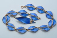 Lot 602 - A silver and blue enamel necklace, brooch and...