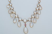 Lot 614 - A moonstone and pink sapphire fringe necklace,...