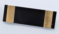 Lot 616 - An onyx and yellow metal Art Deco brooch, the...