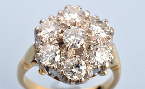 Lot 619 - A diamond cluster ring, the central brilliant...