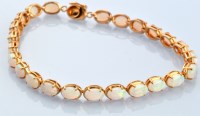 Lot 631 - An opal bracelet, the twenty-four oval opal...