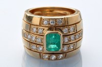 Lot 633 - An emerald, diamond and yellow metal ring, the...