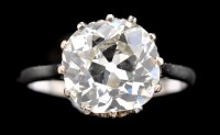 Lot 638 - A solitaire diamond ring, the cushion cut...