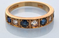 Lot 650 - A sapphire and diamond half hoop eternity ring,...