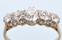 Lot 658 - A five stone diamond ring, the graduated...