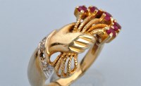 Lot 659 - A ruby, diamond and 14ct. yellow gold ring,...