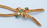 Lot 666 - An emerald, diamond and yellow gold necklace,...