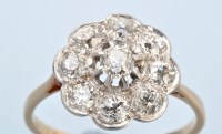 Lot 673 - A diamond cluster ring, the nine old cut...