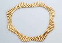 Lot 676 - A mid 20th Century 9ct. yellow gold necklace,...