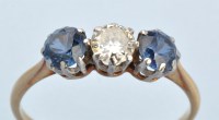 Lot 679 - A sapphire and diamond ring, the central...