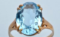 Lot 681 - An aquamarine ring, the oval facet cut...