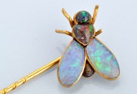 Lot 689 - An opal and yellow metal fly pattern tie pin,...