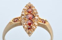 Lot 693 - A diamond and garnet ring, the five graduated...