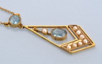 Lot 698 - An Edwardian aquamarine and seed pearl drop...