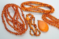 Lot 699 - A collection of amber, to include: a honeycomb...