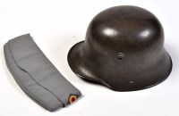 Lot 709 - A Second World War German helmet, with inner...