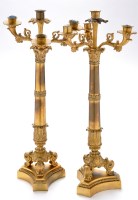 Lot 799 - *A pair of Regency ormolu candlesticks, each...