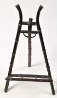 Lot 805 - An early 20th Century ebonised and gold...